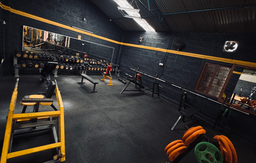 Members training at the squat rack