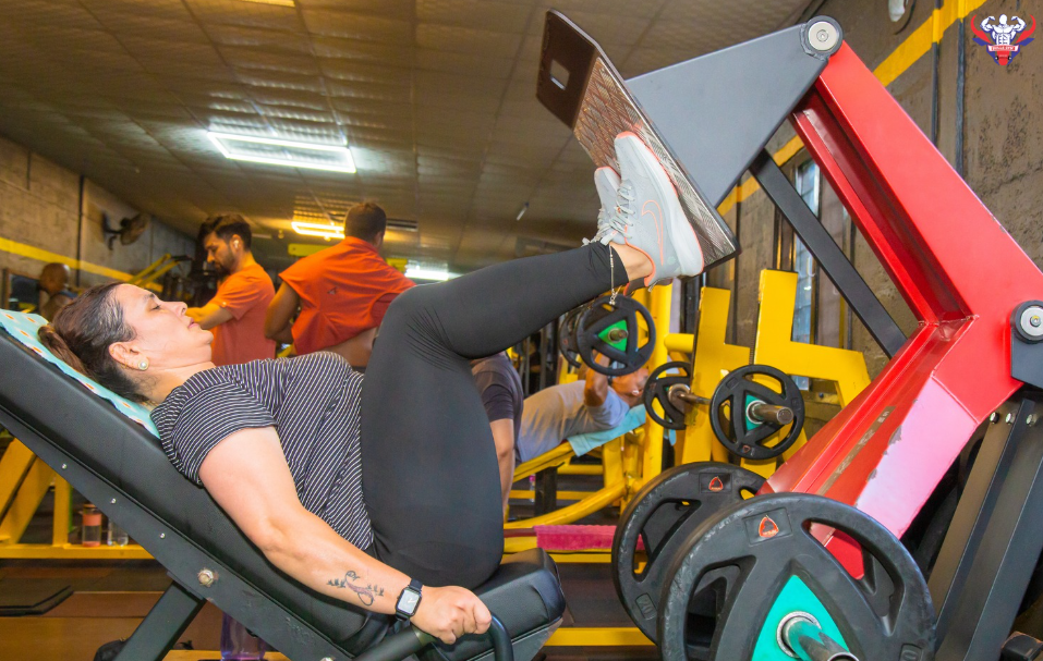 Members training at the squat rack